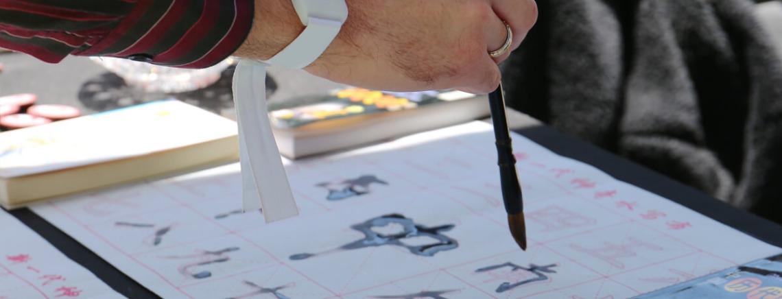 Closeup of hand writing calligraphy